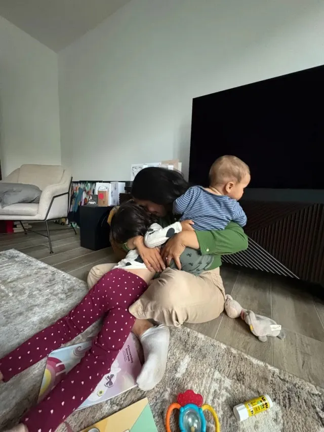 Mom hugging her children