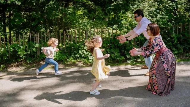 Multicultural family playing in a park